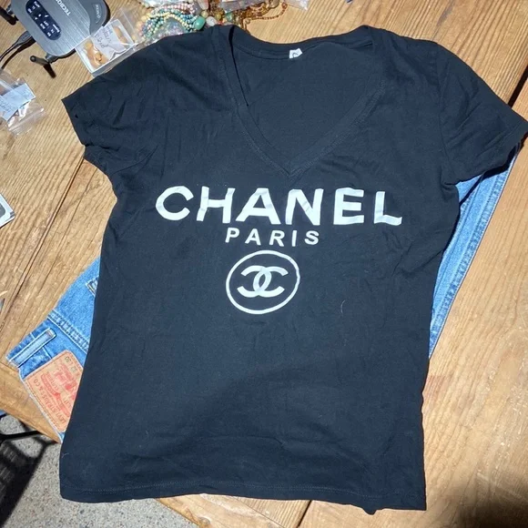 Chanel white logo on black V neck T-shirt. Size marked large, fits like sm/med. - Picture 2 of 6